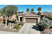 Charming single-story home with a well-manicured yard and a two-car garage at 12364 W Rosewood Ln, Peoria, AZ 85383