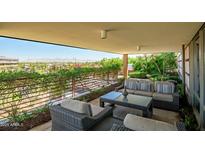 Inviting covered patio with comfortable seating and scenic views of the city and mountains beyond at 7161 E Rancho Vista Dr # 6001, Scottsdale, AZ 85251
