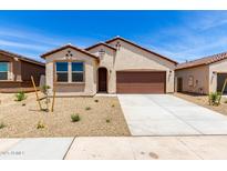 Charming single-story home featuring a neutral color palette and a two-car garage at 18162 W Cielo Grande Ave, Surprise, AZ 85387