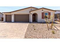 Inviting single-story home showcasing a well-manicured yard, covered entryway, and a two-car garage at 12333 W Marguerite Ave, Avondale, AZ 85323