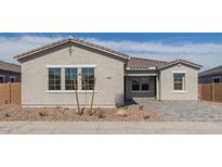 Charming single-story home featuring desert landscaping, tiled roof and neutral color palette at 11946 W Parkway Ln, Avondale, AZ 85323