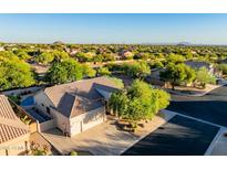 Beautiful aerial view of the home and neighborhood with desert landscaping and a private pool at 3060 N Ridgecrest -- # 56, Mesa, AZ 85207
