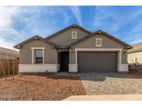 Single-story home with a two-car garage and neutral color scheme at 8326 N 54Th Ln, Glendale, AZ 85302