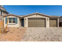 Charming single-story home featuring a three car garage and low maintenance landscaping at 12330 W Marguerite Ave, Avondale, AZ 85323