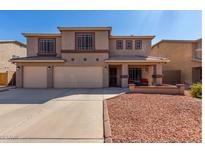 Two-story house with three-car garage and landscaped front yard at 4321 E Morenci Rd, San Tan Valley, AZ 85143