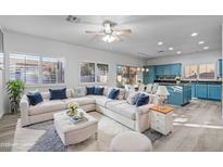 Bright living room featuring a large sectional sofa and kitchen views at 3640 S Springs Dr, Chandler, AZ 85286