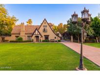 Charming Tudor-style home with manicured lawn and walkway at 363 E Monte Vista Rd, Phoenix, AZ 85004
