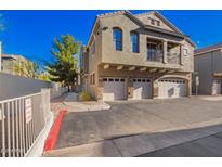 Attractive townhome with three garage spaces and a small balcony on a sunny day at 2402 E 5Th St # 1481, Tempe, AZ 85288