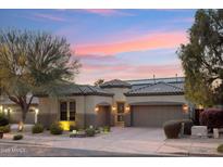 Beautiful single-story home with a landscaped front yard and two-car garage at 35518 N 30Th Dr, Phoenix, AZ 85086