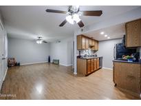Open concept dining area adjacent to the kitchen with wood flooring at 3402 N 32Nd St # 141, Phoenix, AZ 85018