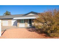 Brick home with a spacious yard and a two-car garage at 9622 W Cinnabar Ave # B, Peoria, AZ 85345