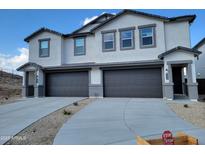 Two-story home with attached two-car garage and landscaping at 9842 S 11Th St, Phoenix, AZ 85042