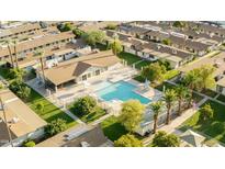 Community pool with ample space for residents to relax and enjoy the water at 6721 E Mcdowell Rd # 316G, Scottsdale, AZ 85257