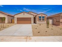 Charming single-story home showcasing a desert landscape, neutral colors, and a two-car garage at 18156 W Cielo Grande Ave, Surprise, AZ 85387