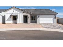 Charming single-story home featuring a modern design with stone accents and a two-car garage at 4780 W Flat Iron Ct, Queen Creek, AZ 85144