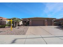 One-story home with three-car garage and desert landscaping at 19403 N Ponderosa Ct, Surprise, AZ 85387