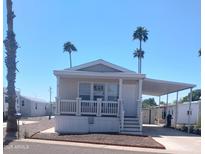 Charming single-story home with a covered carport and manicured landscaping in a sunny, vibrant community at 7300 N 51St Ave # F 99, Glendale, AZ 85301