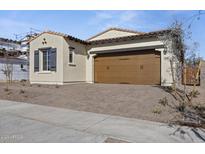 One-story home with a brown garage door and paved driveway at 2134 W Rowel Rd, Phoenix, AZ 85085