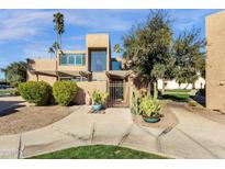 Inviting exterior with desert landscaping and gated entry at 7401 N Scottsdale Rd # 3, Paradise Valley, AZ 85253