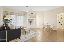 Inviting living room featuring a ceiling fan, neutral tones and cozy seating arrangement at 10401 N Saguaro Blvd # 224, Fountain Hills, AZ 85268