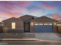 Single-story home with a two-car garage at 36973 W La Paz St, Maricopa, AZ 85138