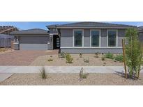 Charming single-story home featuring a two-car garage and low maintenance desert landscaping at 17134 W Hackamore Dr, Surprise, AZ 85387