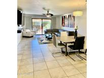 Spacious living room with large sectional sofa and sliding glass doors at 272 Leisure World --, Mesa, AZ 85206