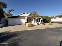 Charming single-story home with a well-manicured yard and a two-car garage in a quiet neighborhood at 402 W Grandview Rd, Phoenix, AZ 85023