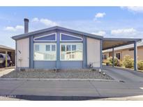 Charming single-story home with carport and desert landscaping for low maintenance appeal at 11275 N 99Th Ave # 145, Peoria, AZ 85345