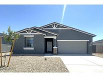 Charming single-story home featuring a neutral color scheme, low maintenance landscaping, and attached two-car garage at 46963 W Coe St, Maricopa, AZ 85139