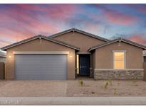 Charming single-story home showcasing a neutral color scheme, a gray garage door, and a well-manicured front yard at 4994 W Hunter Trl, San Tan Valley, AZ 85144