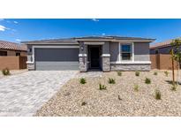 Charming single-story home with a two-car garage and low maintenance desert landscaping at 18714 E Panchito Dr, Gold Canyon, AZ 85118