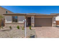 Charming single-story home featuring desert landscaping and a two-car garage at 18792 E Panchito Dr, Gold Canyon, AZ 85118