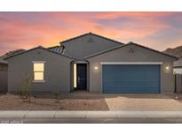 Charming single-story home featuring a blue garage door, a modern gray exterior and low-maintenance desert landscaping at 4937 W Hunter Trl, San Tan Valley, AZ 85144