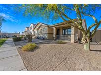 Charming curb appeal with inviting porch and well-manicured landscaping at 1724 S Rockwell St, Gilbert, AZ 85295