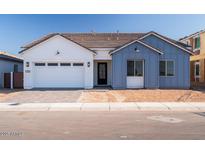 Charming single-Gathering home with a two-car garage, manicured lawn, and inviting front entrance at 1296 E Coconino Way, Gilbert, AZ 85298