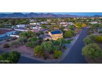 An aerial view showcasing this spacious two-story home with solar panels and well-maintained landscaping at 10647 N 82Nd Pl, Scottsdale, AZ 85260