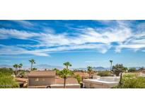 Aerial view of community with mountain views, palm trees, and Spanish style homes at 14645 N Fountain Hills N Blvd # 215, Fountain Hills, AZ 85268