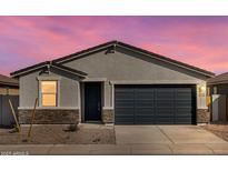 Charming single-story home featuring stacked stone accents, a two car garage, and neutral colors at 3360 E Audrey Dr, San Tan Valley, AZ 85143