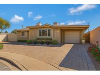 Charming single-story home featuring a brick driveway, manicured landscaping, and a one-car garage at 1859 N Morris --, Mesa, AZ 85201