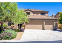 Charming two-story home with three-car garage, desert landscaping, and classic Southwest design at 10646 E Butherus Dr, Scottsdale, AZ 85255