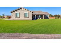 One-story house with a large green lawn and a covered patio at 28308 N 157Th Pl, Scottsdale, AZ 85262