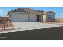 New single-story home with two-car garage and desert landscaping at 28976 N 174Th Ln, Surprise, AZ 85387