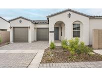 Charming single-story home with a well-maintained front yard and attached two-car garage at 17643 W Middlebury St, Surprise, AZ 85388