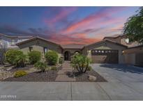 Charming single-story home with desert landscaping, brick walkway, and attached two-car garage at 3414 E Virgil Dr, Gilbert, AZ 85298