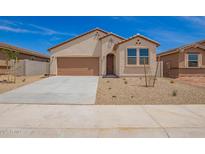 Charming single-story home with stucco siding, desert landscaping, and a two-car garage on a sunny day at 18246 W Cielo Grande Ave, Surprise, AZ 85387