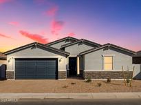 Charming single-story home featuring desert landscaping, a two-car garage, and an inviting front entrance at 4922 W Hunter Trl, San Tan Valley, AZ 85144