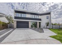 Contemporary two-story home with a spacious driveway and modern landscaping at 4414 N 29Th St, Phoenix, AZ 85016