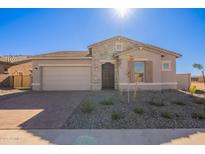 One-story home with stone accents, landscaped yard, and two-car garage at 18955 W Ocotillo Rd, Waddell, AZ 85355