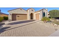 Spacious driveway leading to garages, providing ample parking and enhancing the home's curb appeal at 27478 W Tonopah Dr, Buckeye, AZ 85396